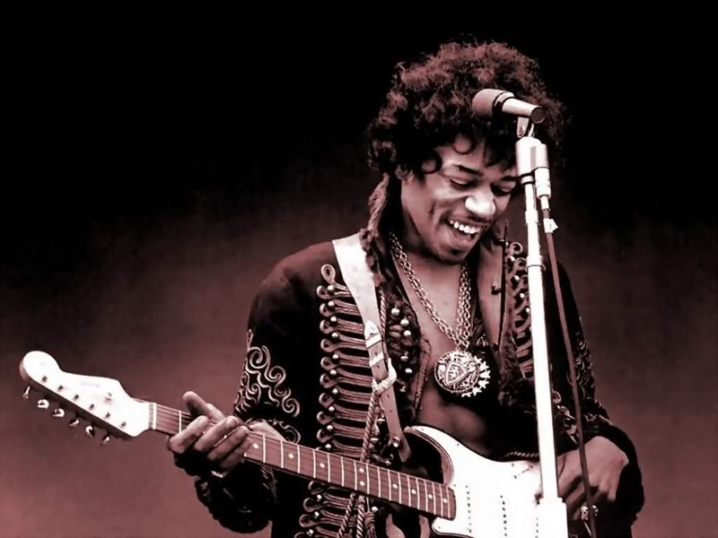 Jimi Hendrix playing guitar on stage